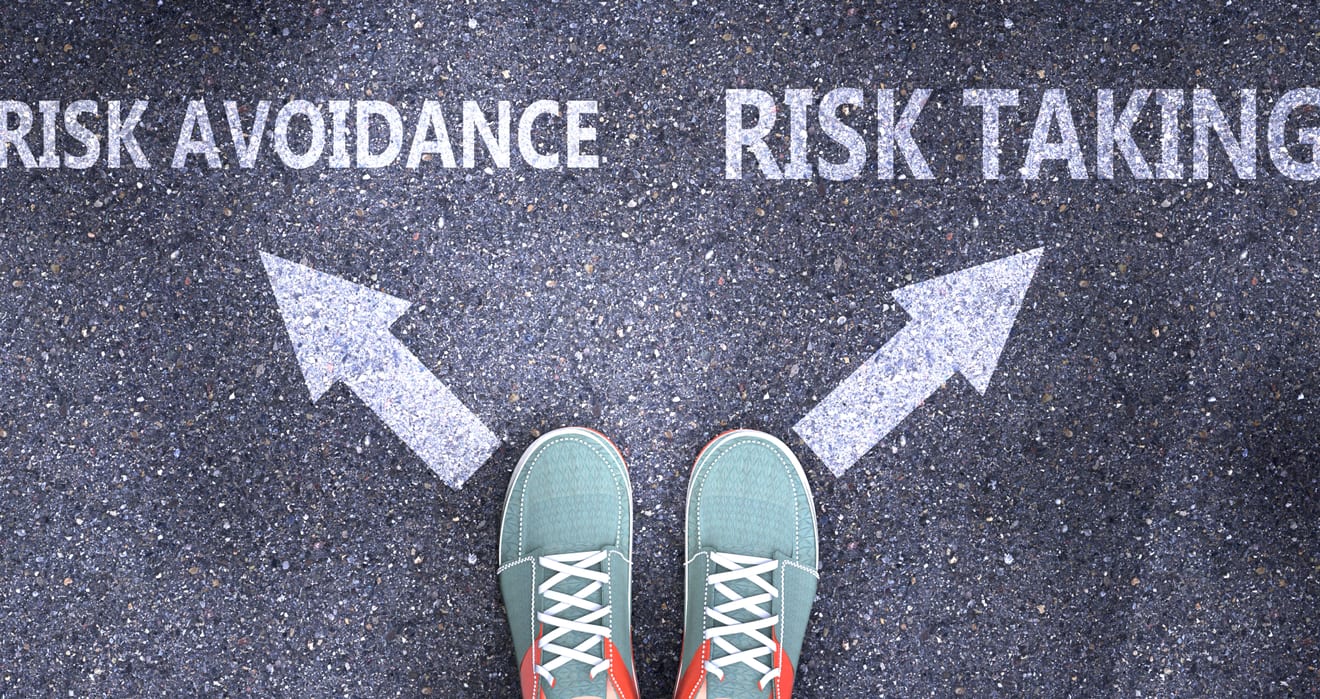Choosing between risk avoidance and risk taking—symbolic decision-making at a crossroads.