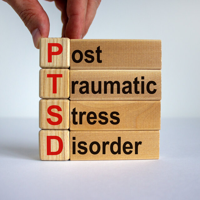 Person healing from trauma and post-traumatic stress with therapy support