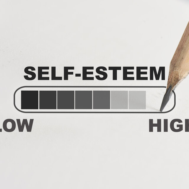 Person reflecting on self-worth, confidence, and self-esteem recovery